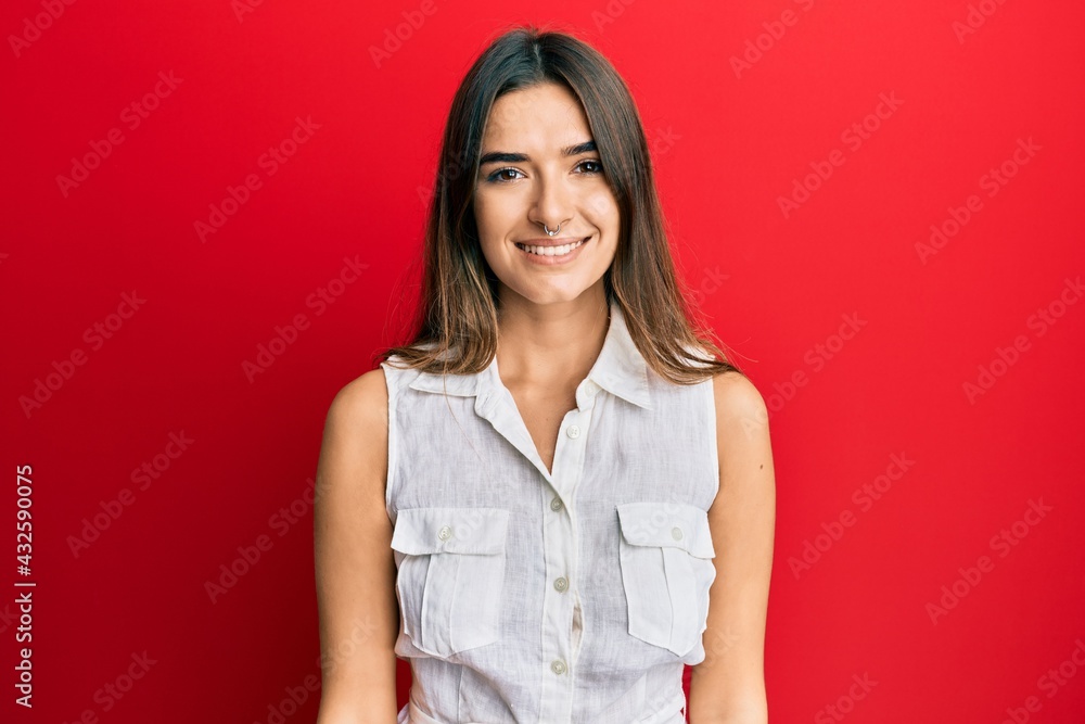 Young hispanic woman wearing casual clothes with a happy and cool smile on face. lucky person. Young hispanic woman wearing casual clothes with a happy and cool smile on face. lucky person.