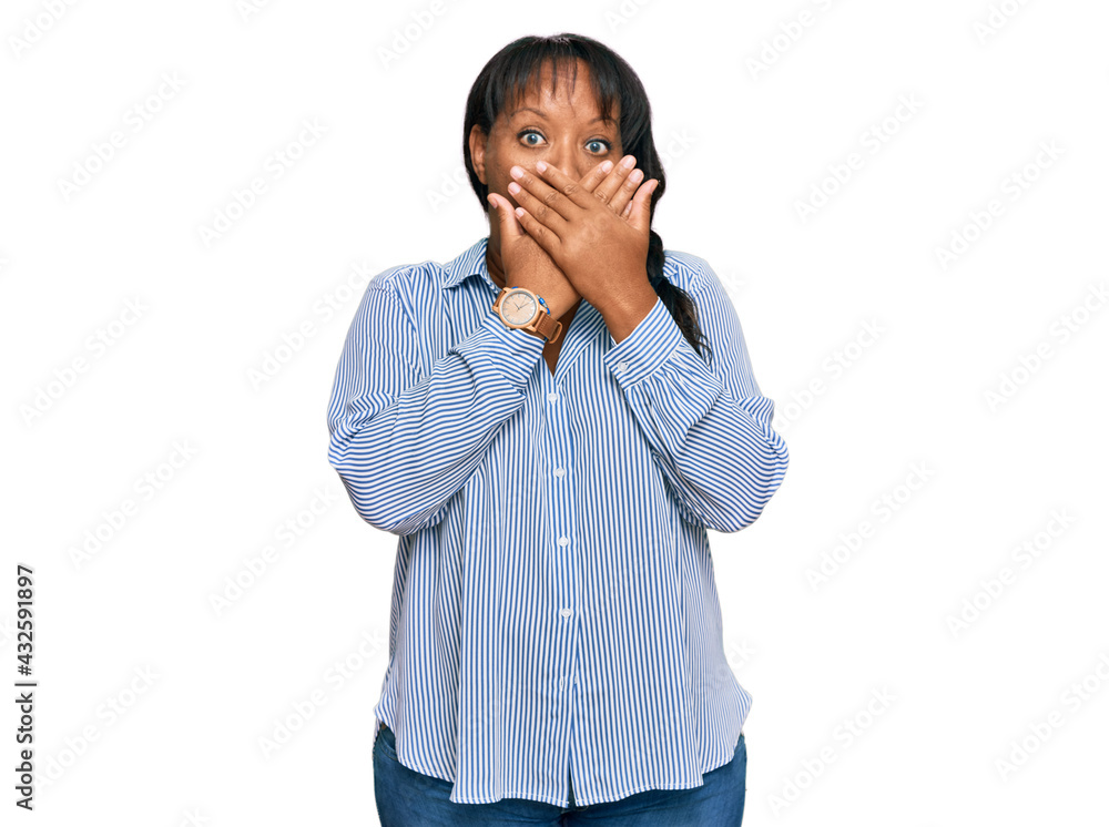 Hispanic middle age woman wearing casual clothes shocked covering mouth with hands for mistake. secret concept. Hispanic middle age woman wearing casual clothes shocked covering mouth with hands for mistake. secret concept.