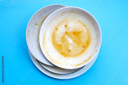 Dirty dishes on blue background.