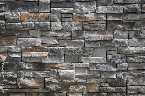 Background of  gray stone wall made with blocks . Pattern of slate wall texture and background