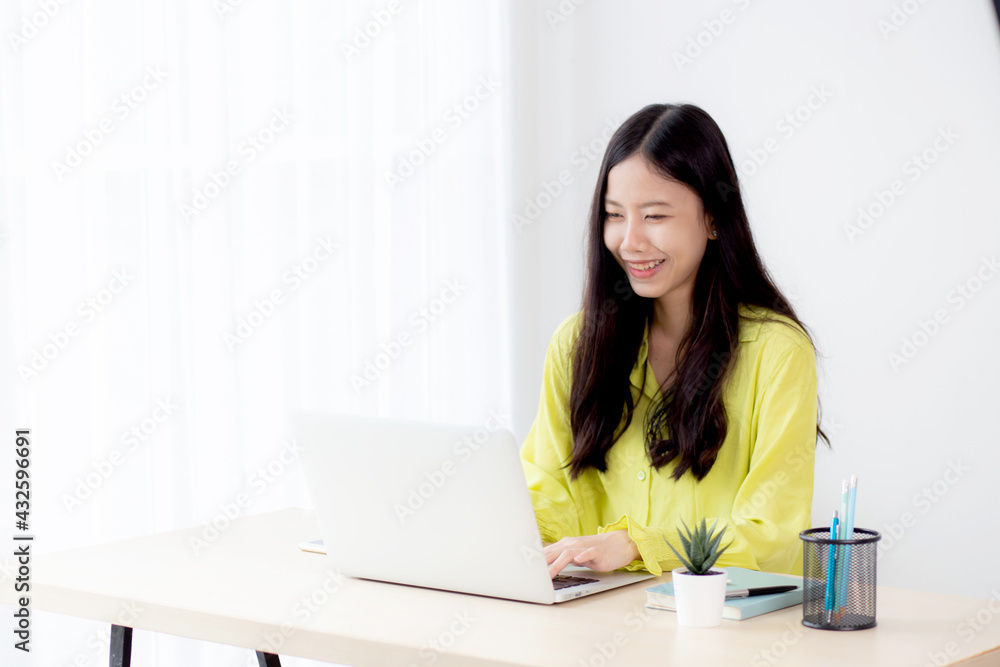 Young asian businesswoman working on laptop computer on desk at home office, freelance looking and typing on notebook on table, lifestyle of woman studying online, business and education concept. Young asian businesswoman working on laptop computer on desk at home office, freelance looking and typing on notebook on table, lifestyle of woman studying online, business and education concept.