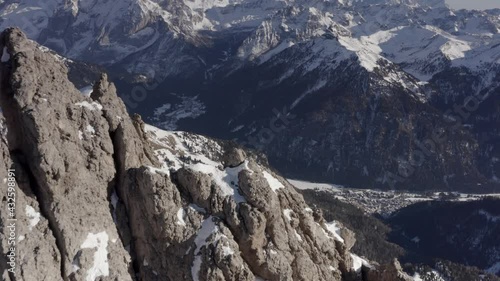 Aerial flight adove stunning Alps Cliffs. 
High mountain peaks sharp cliffs Dolomites, Italy
Drone view  from Italy Top Peaks 

 photo