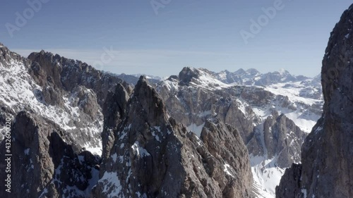 Wallpaper Mural Aerial flight adove stunning Alps Cliffs. 
High mountain peaks sharp cliffs Dolomites, Italy
Drone view  from Italy Top Peaks 

 Torontodigital.ca
