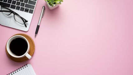 Pink background tablet coffee top view pink copy space.