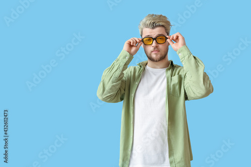 Young man with stylish sung...