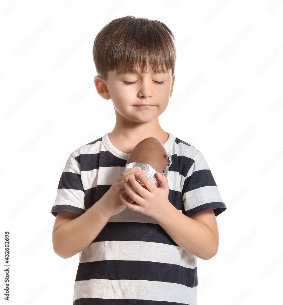 Cute little boy with chocolate Easter egg on white background Cute little boy with chocolate Easter egg on white background
