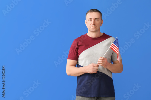Man with USA flag on color ...