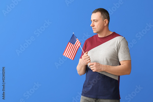 Man with USA flag on color ...