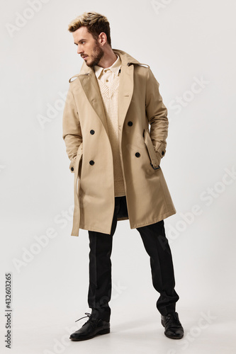 stylish man in beige coat and pants trend fashion style shoes model