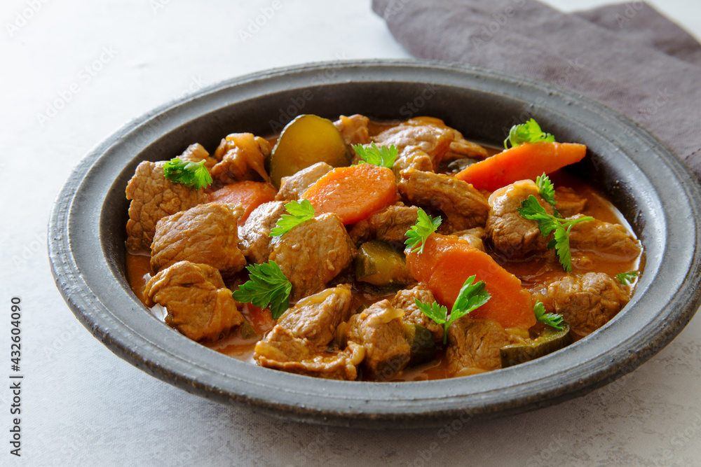 Beef tatarian goulash (azu) in rustic old plate close up Beef tatarian goulash (azu) in rustic old plate close up