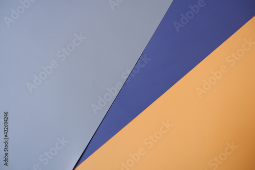 Layered color papers, color paper materials for banner, background and wall paper design. yellow, sky blue and blue papers.