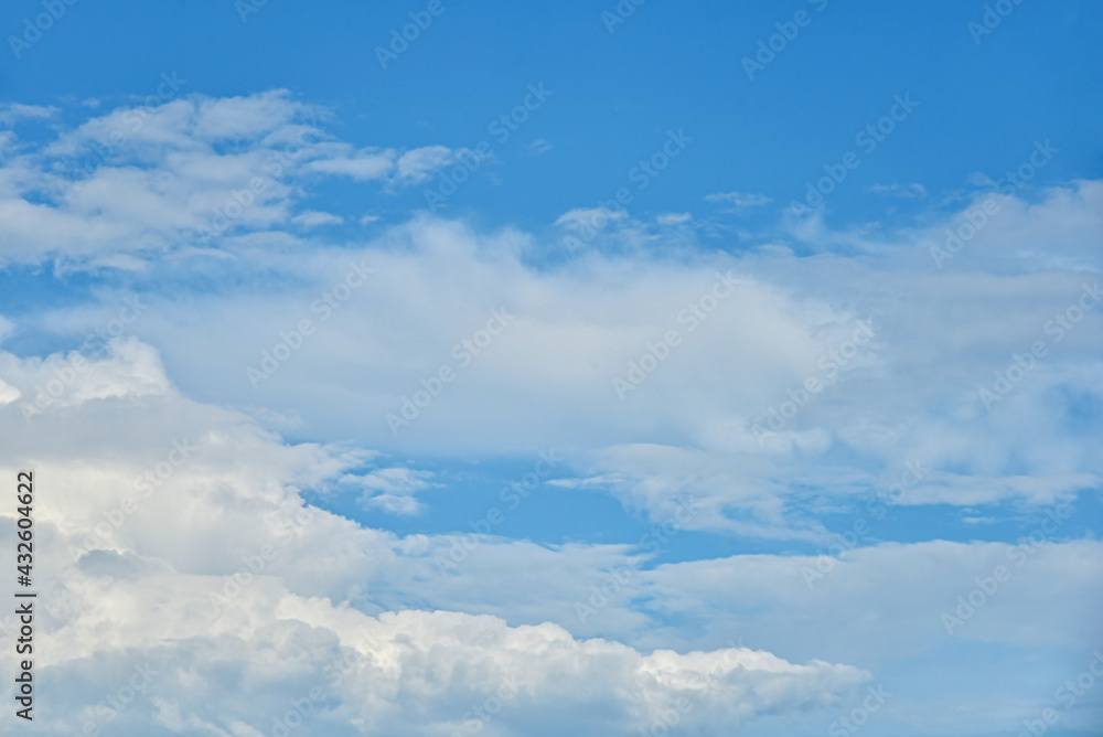 Fototapeta premium Beautiful white clouds on blue sky background.