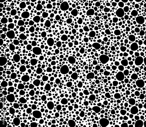 Geometric seamless pattern with black polka dots of small and large scale. Monochrome texture with scattered, random circles shapes. Black and white hand drawn dots. Vector bubble background