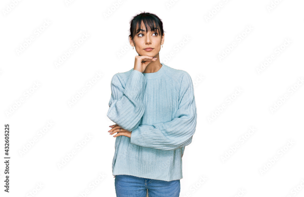 Young hispanic woman wearing casual clothes with hand on chin thinking about question, pensive expression. smiling and thoughtful face. doubt concept. Young hispanic woman wearing casual clothes with hand on chin thinking about question, pensive expression. smiling and thoughtful face. doubt concept.