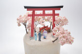a mini figure Prayer in shrine with Cherry blossoms