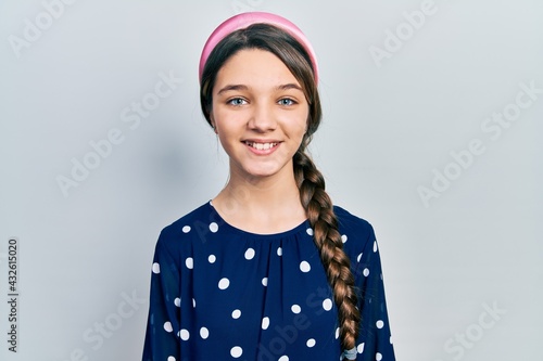 Young brunette girl wearing elegant look with a happy and cool smile on face. lucky person.
