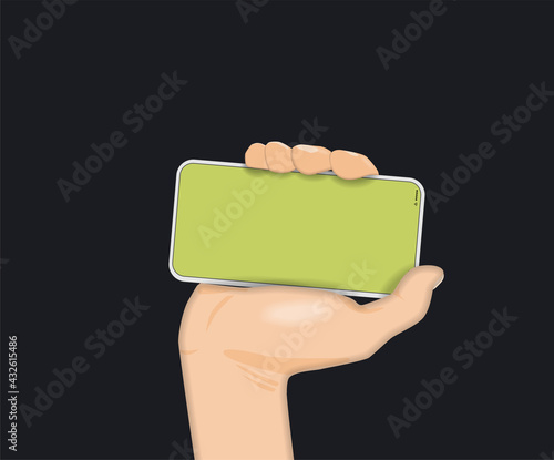 A man's hand firmly holds a mobile phone