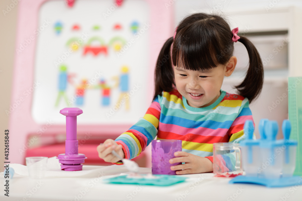 young girl pretend playing food preparing at home young girl pretend playing food preparing at home