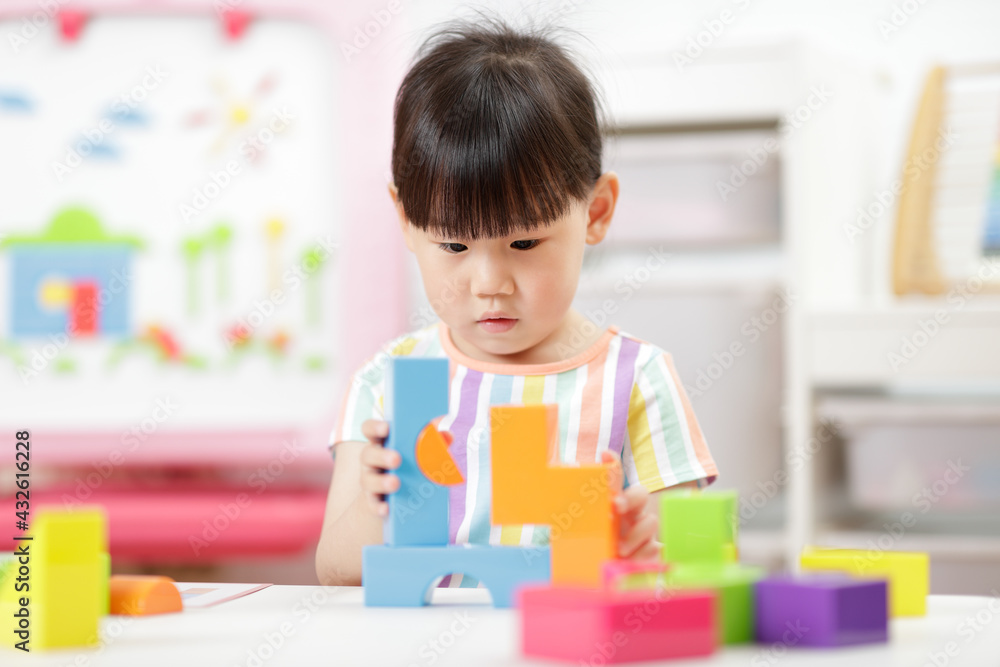 young girl playing creative blocks at home young girl playing creative blocks at home
