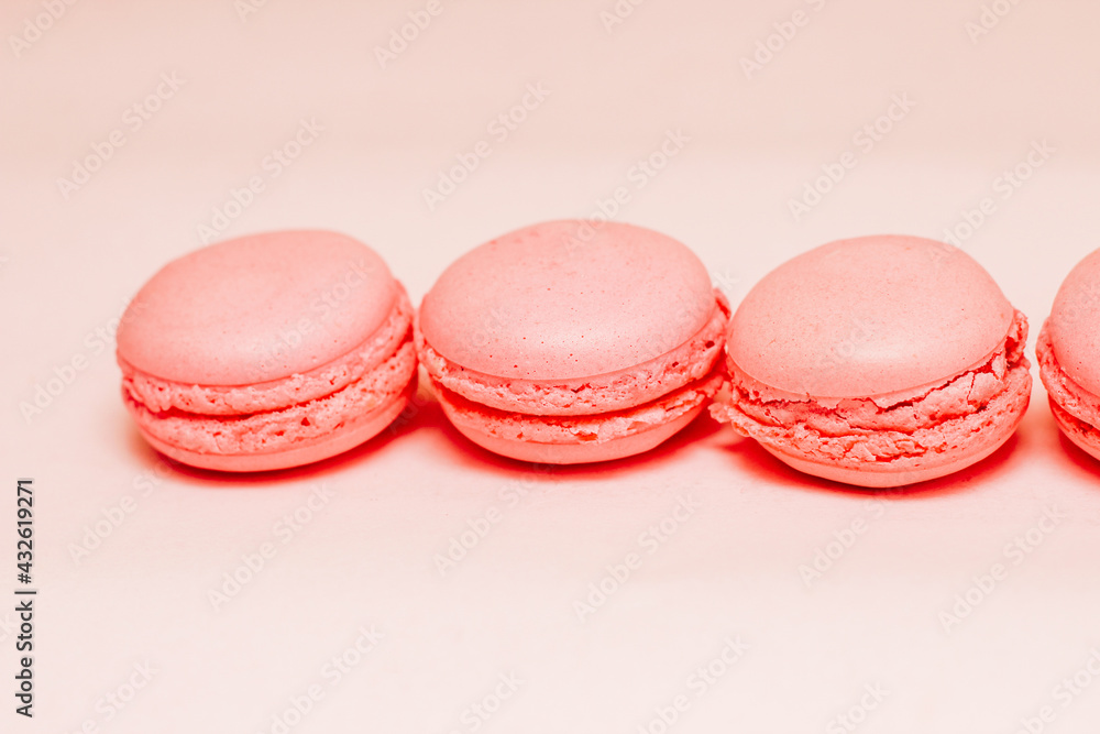 French pink macaroon cookies on silk tablecloth French pink macaroon cookies on silk tablecloth