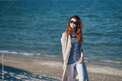 woman on the sea in the mountains on the beach and sand waves landscape model