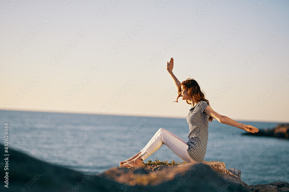 happy traveler in the mountains outdoors near the sea gesturing with her hands vacation model happy traveler in the mountains outdoors near the sea gesturing with her hands vacation model