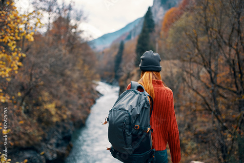 woman hiker in the east near the river mountains landscape travel