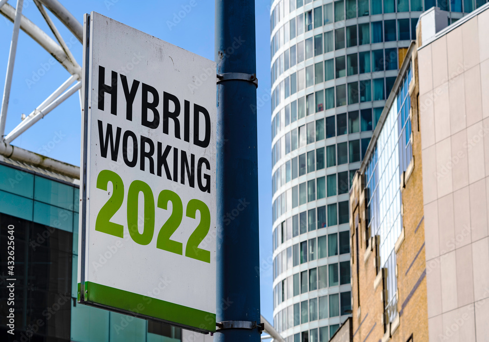 Hybrid Working 2022 sign in a downtown city center Hybrid Working 2022 sign in a downtown city center