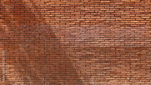 Light and shadow on a reddish-brown brick wall. Interesting dimensional abstract background and texture with block brick geometric pattern on building wall with copy space. Selective focus