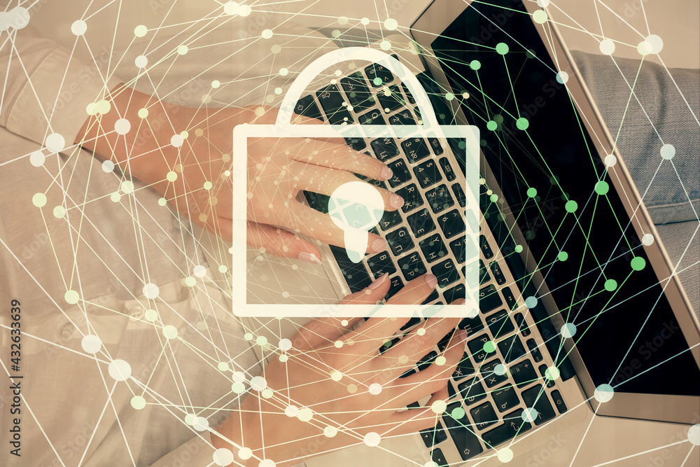 Double exposure of woman hands working on computer and lock hologram drawing. Top View. Security concept. Double exposure of woman hands working on computer and lock hologram drawing. Top View. Security concept.