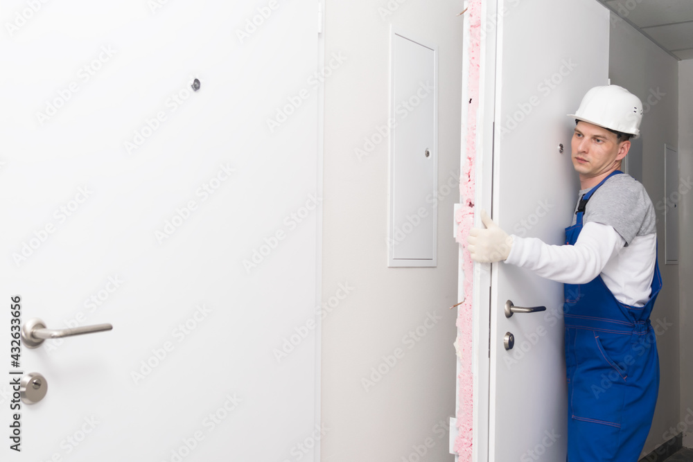 door installation worker replaced the old one with a new one door installation worker replaced the old one with a new one