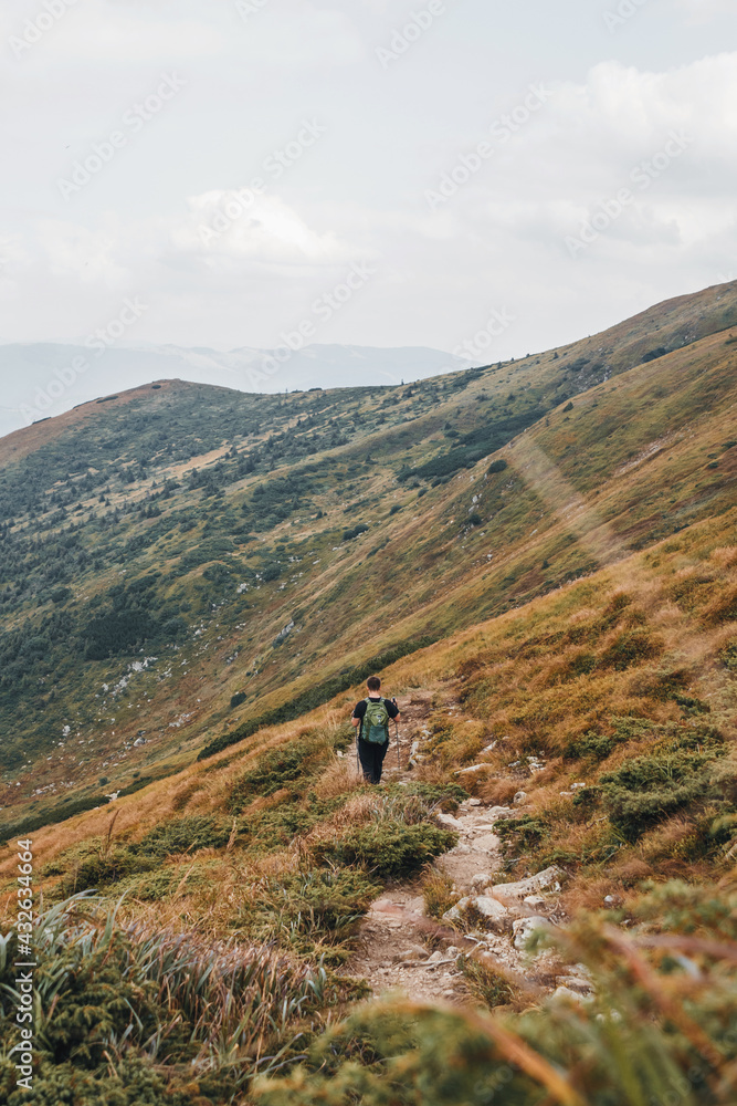 Man is hiking from mountain Hoverla. Carpathian mountains.