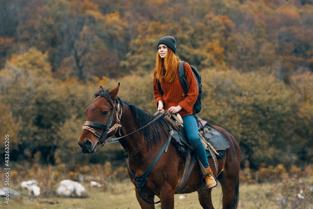 woman riding a horse on nature mountains travel adventure woman riding a horse on nature mountains travel adventure
