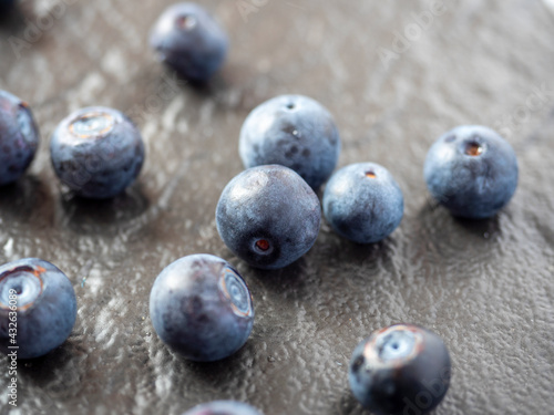 juicy ripe blueberries on a textured dark background. Close-up, berries, edaa