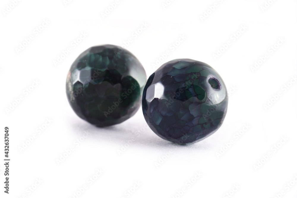 Patterned Green agate beads isolated on white,Round Agate beads,Semi Precious stones. Natural mineral beads. Beads made of natural stones to create jewelry. Patterned Green agate beads isolated on white,Round Agate beads,Semi Precious stones. Natural mineral beads. Beads made of natural stones to create jewelry.