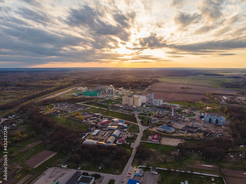 View of factory under the sunset light in Belarus. Drone aerial photo