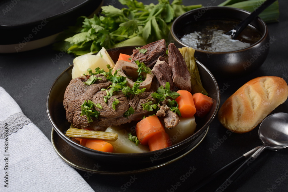 Pot-au-feu, traditional french stew. Stewed beef and potatoes. In France considered a national dish. Pot-au-feu, traditional french stew. Stewed beef and potatoes. In France considered a national dish.