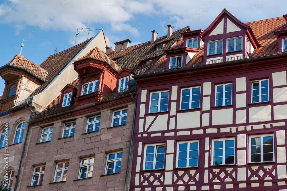 Fototapeta premium Tiled roofs and half-timbered houses in the historic center Nuremberg City, Germany
