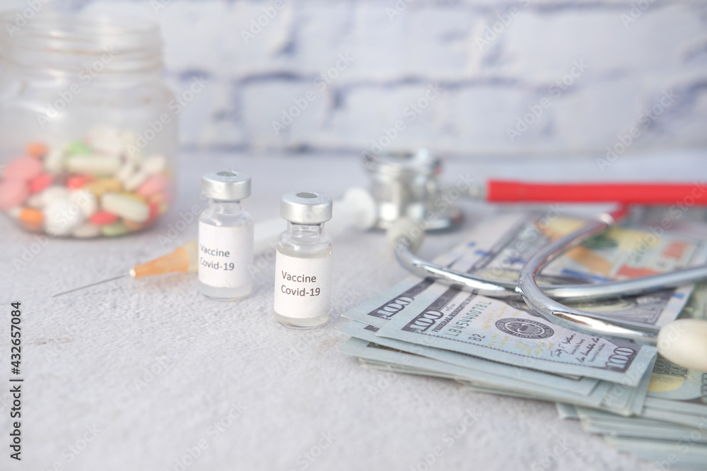 Healthcare cost concept with us dollar, vaccine and pills Healthcare cost concept with us dollar, vaccine and pills