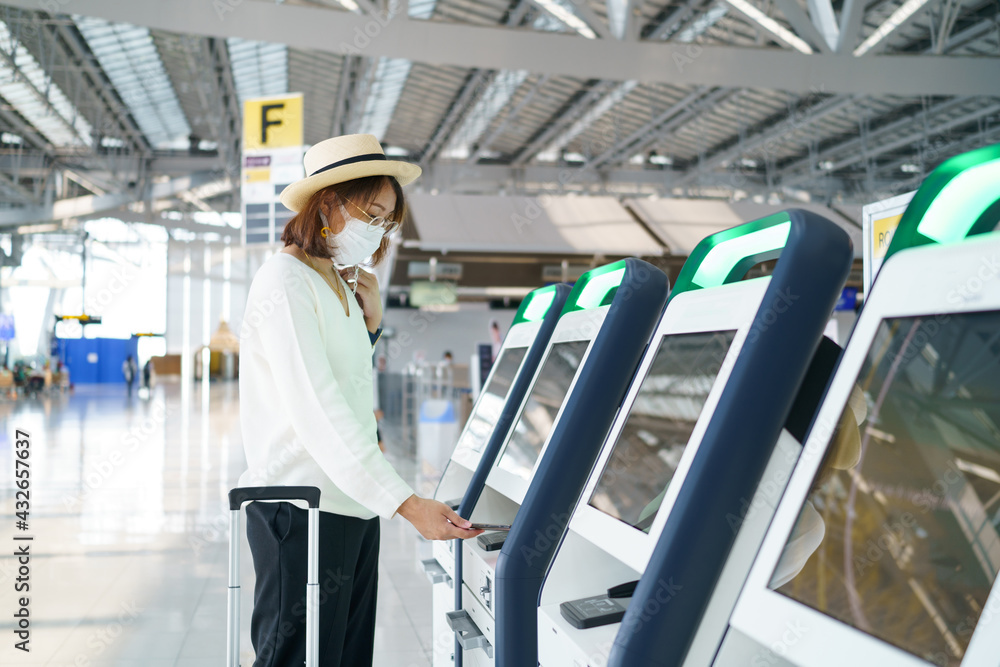 New Normal tourist wearing face mask is traveling on The airport , New lifestyle travel after covid-19. Social distancing healthcare system ,stay safe and Travel bubble concept. New Normal tourist wearing face mask is traveling on The airport , New lifestyle travel after covid-19. Social distancing healthcare system ,stay safe and Travel bubble concept.