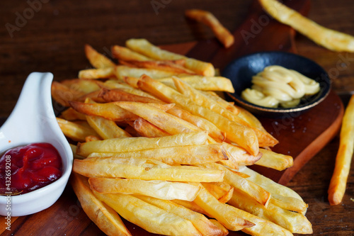 Homemade French fries or potato chips with Mayonnaise and tomato