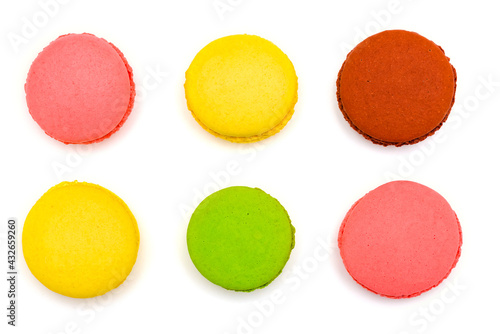 six multicolored macaron cakes on a white background