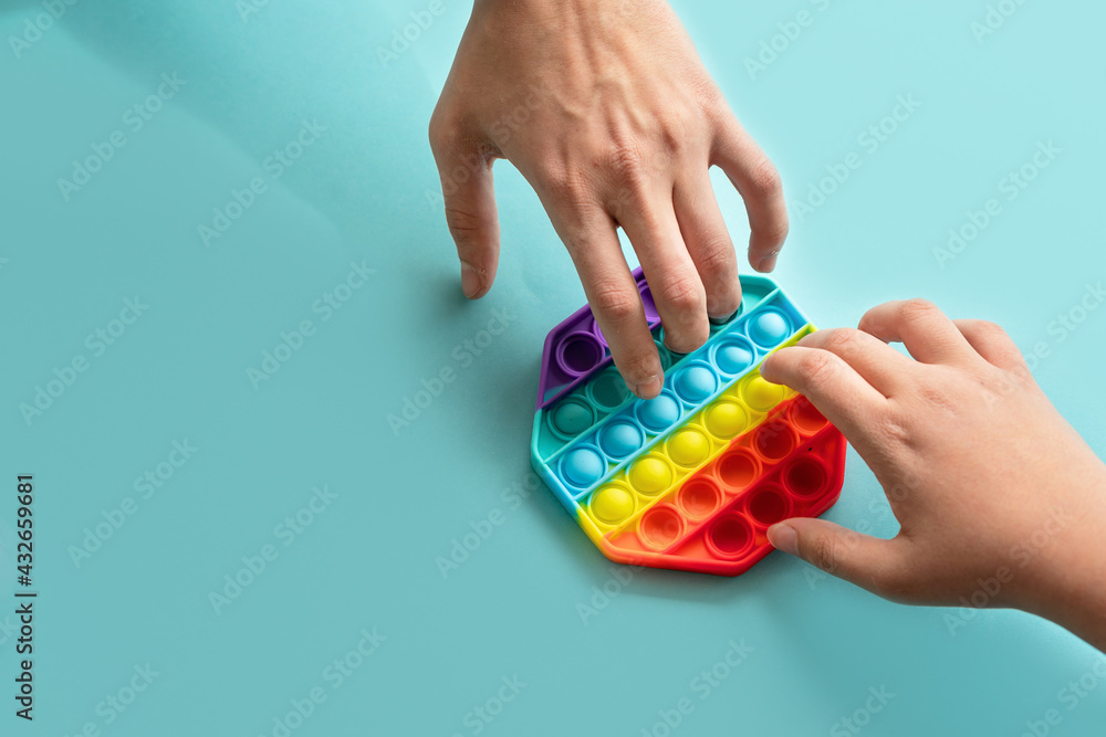 Obraz premium Silicone toy antistress pop it. New trend from tik tok. Colorful anti stress silicone sensors toy.