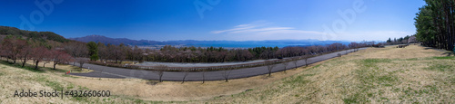 Overlooking an early spring forest and huge lake from a lookout in mountain (Inawashiro, Fukushima, Japan)