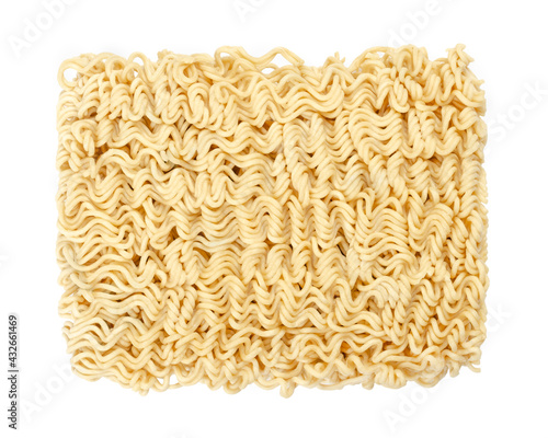 Dried instant noodle block, from above. Instant ramen are noodles sold in precooked and dried block form,  to be soaked in boiling water, but can be also consumed dry. Isolated over white, food photo.