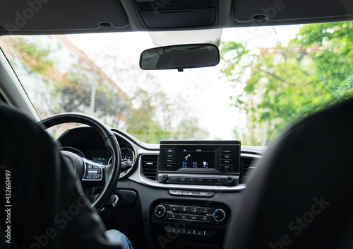 Interior of the car with a multimedia device on the dashboard.  © andrey