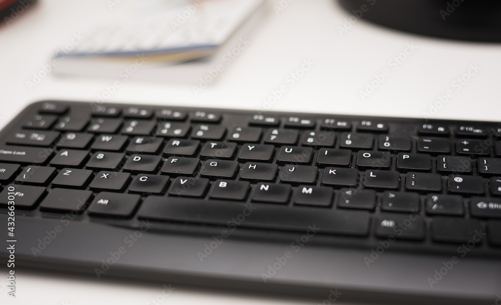 Computer keyboard isolated on desk in the office Computer keyboard isolated on desk in the office