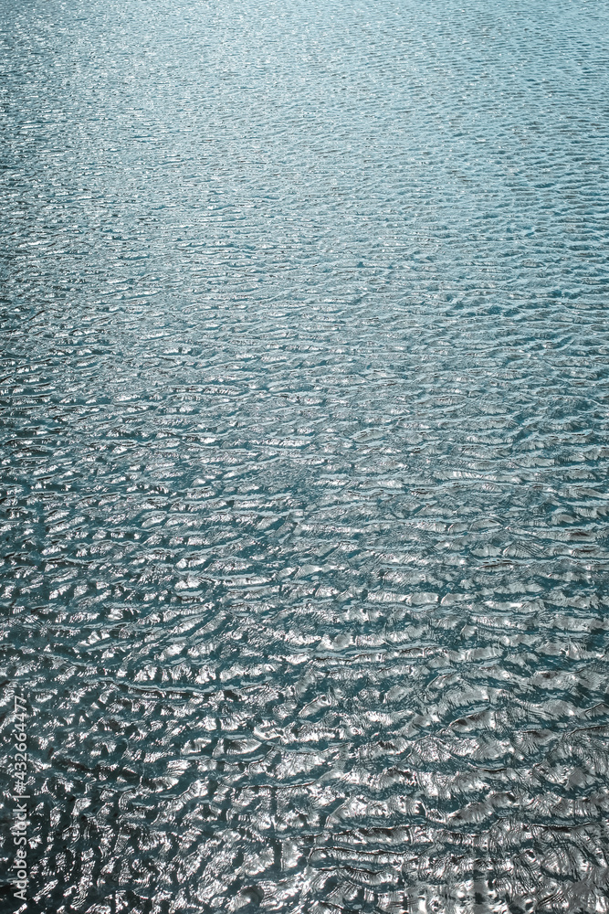 Sea wave and sand seashore at dawn. Golden sun light over the sea. Close up. Concept of vacation, summer Sea wave and sand seashore at dawn. Golden sun light over the sea. Close up. Concept of vacation, summer