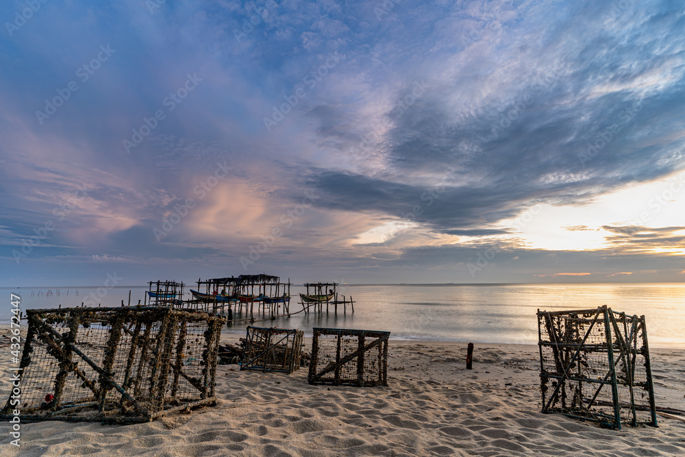 Morning view before sunrise Fishing boat's harbor service at Bang Hoi Beach, Songlkhla, Thailand.