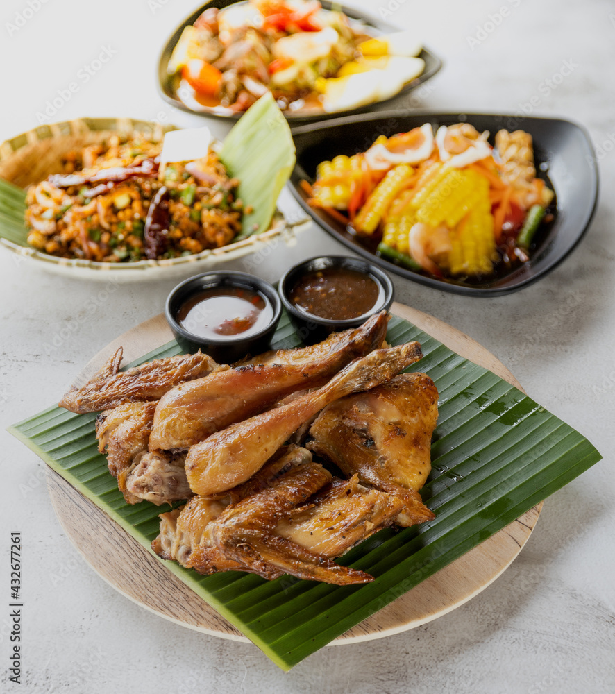 Grilled Chicken Thai Food on the dining table Grilled Chicken Thai Food on the dining table